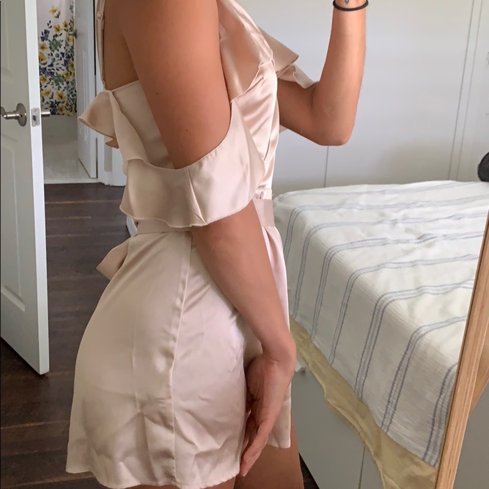 Peachy-cream colored, silky Romper